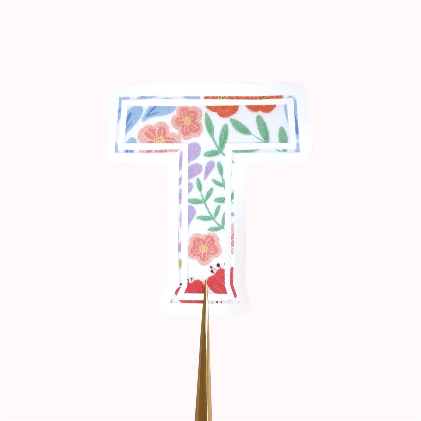 Floral letter 'T' sticker on a white background