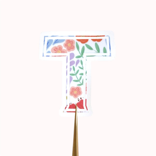 Floral letter 'T' sticker on a white background