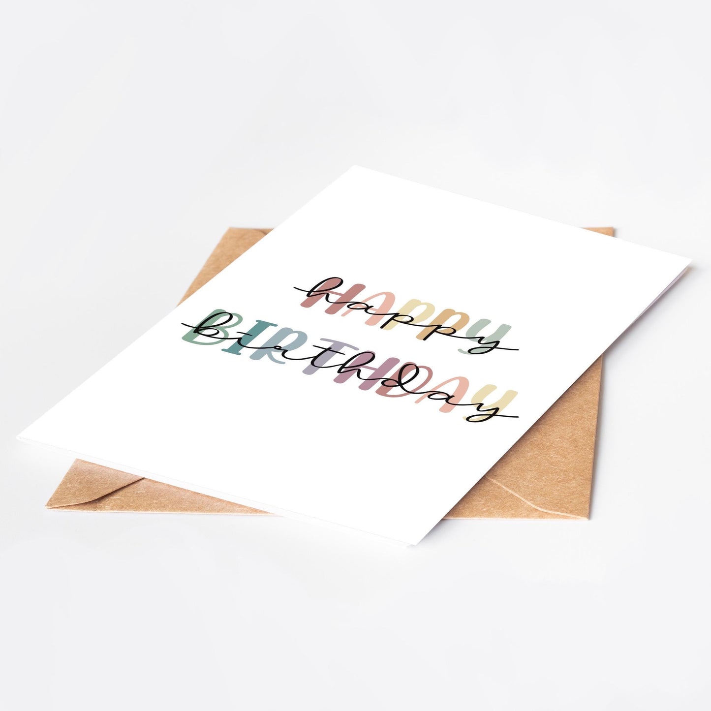 Birthday card with 'Happy Birthday' text in rainbow colours and a brown envelope on a white background
