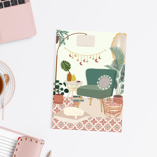 Postcard with illustration of a cozy living room scene with a green armchair, plants, and a rug on a white surface.