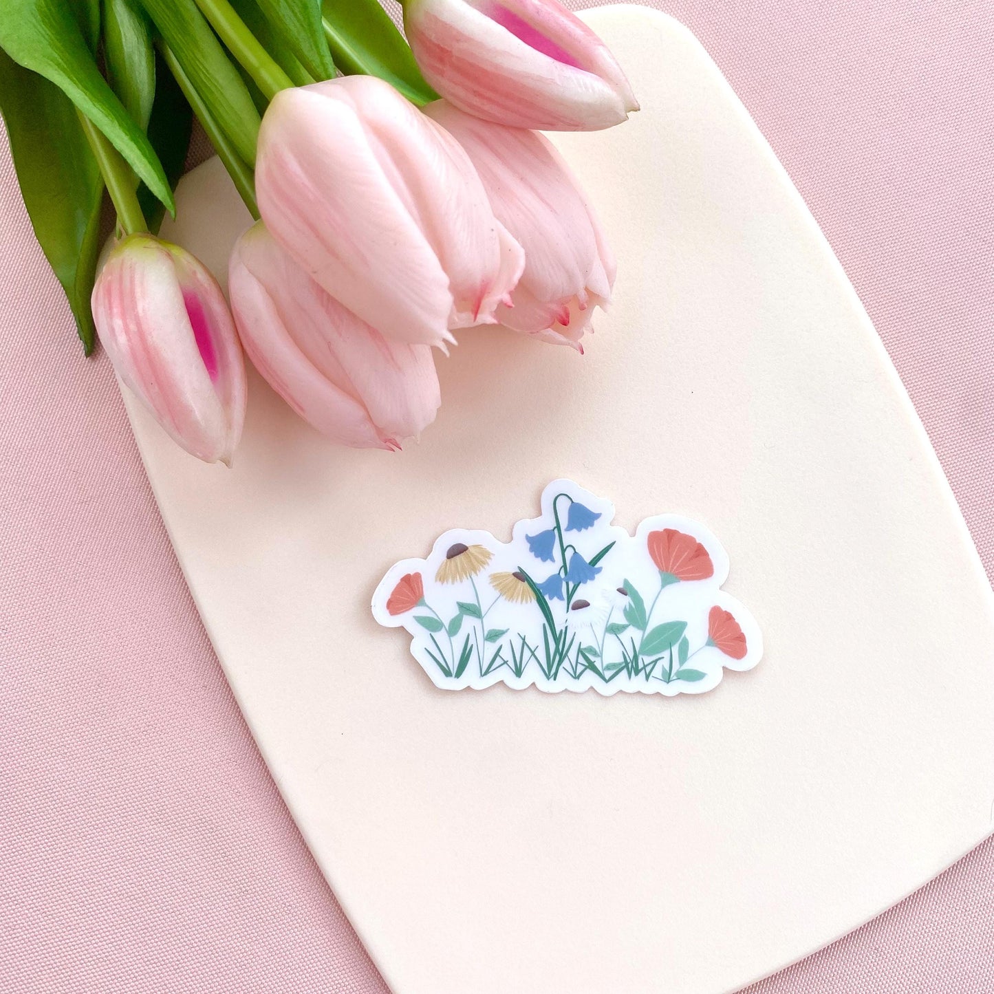 A sticker with colourful garden flowers design on a white background with pink tulips.
