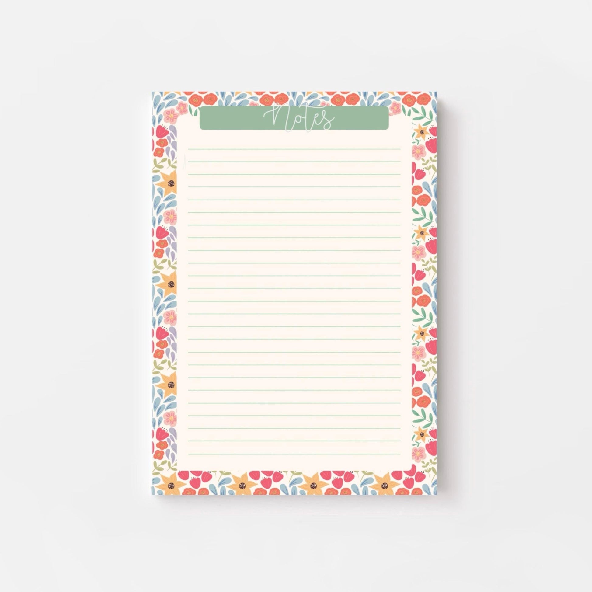 Floral bordered notepad with lined paper on a white background