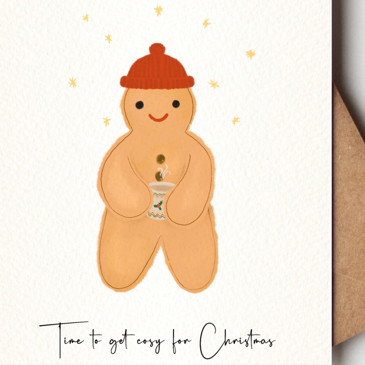 Gingerbread man  with a red hat on a Christmas card with a brown kraft envelope