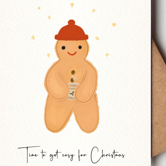 Gingerbread man  with a red hat on a Christmas card with a brown kraft envelope