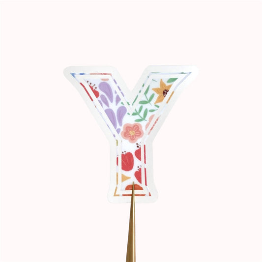 Decorative letter 'Y' sticker with colourful flower designs on a white background
