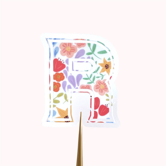 Letter 'R' sticker with floral design on a white background