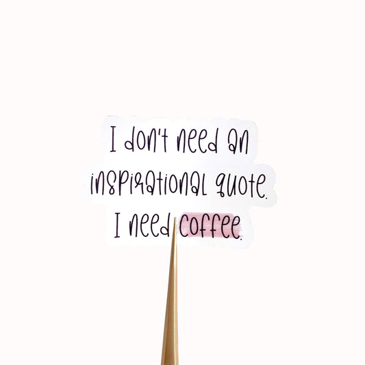 Clear vinyl sticker with black text 'I don't need an inspirational quote, I need coffee' shown on a white background