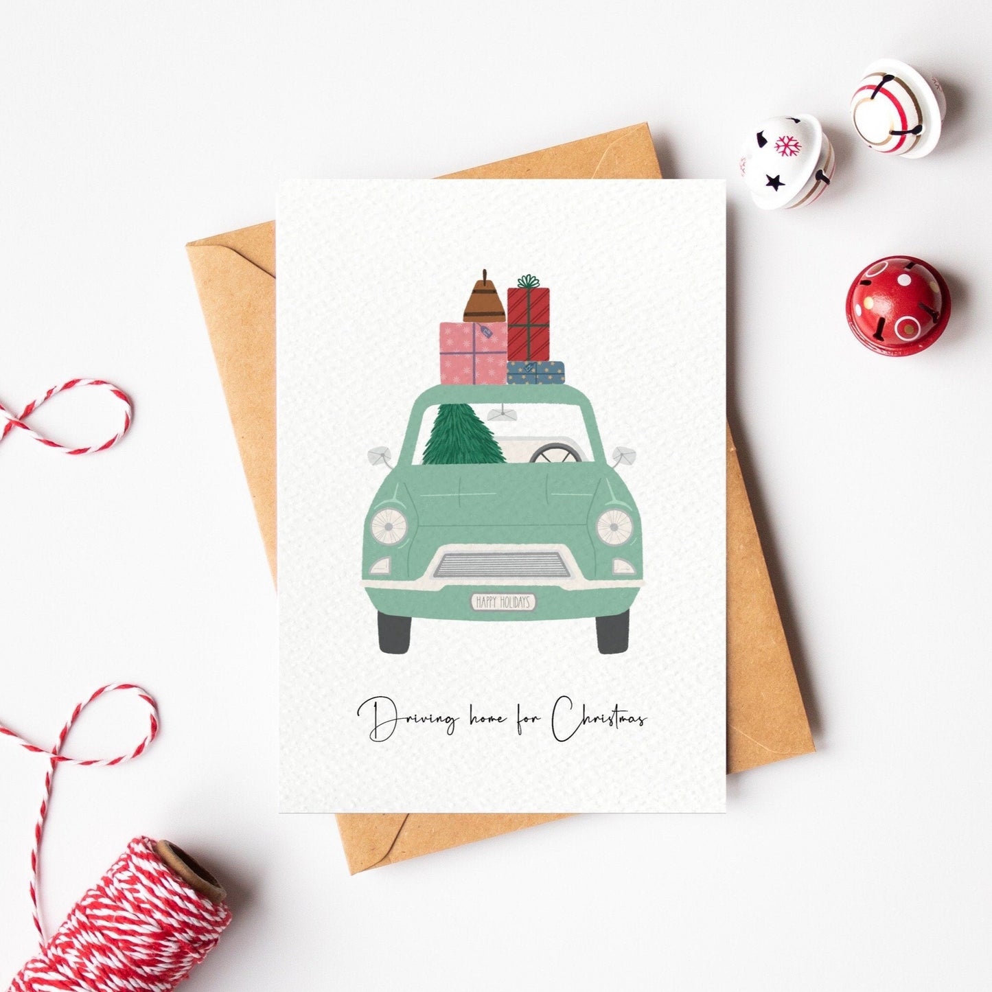 Christmas card with a car carrying presents on a white background