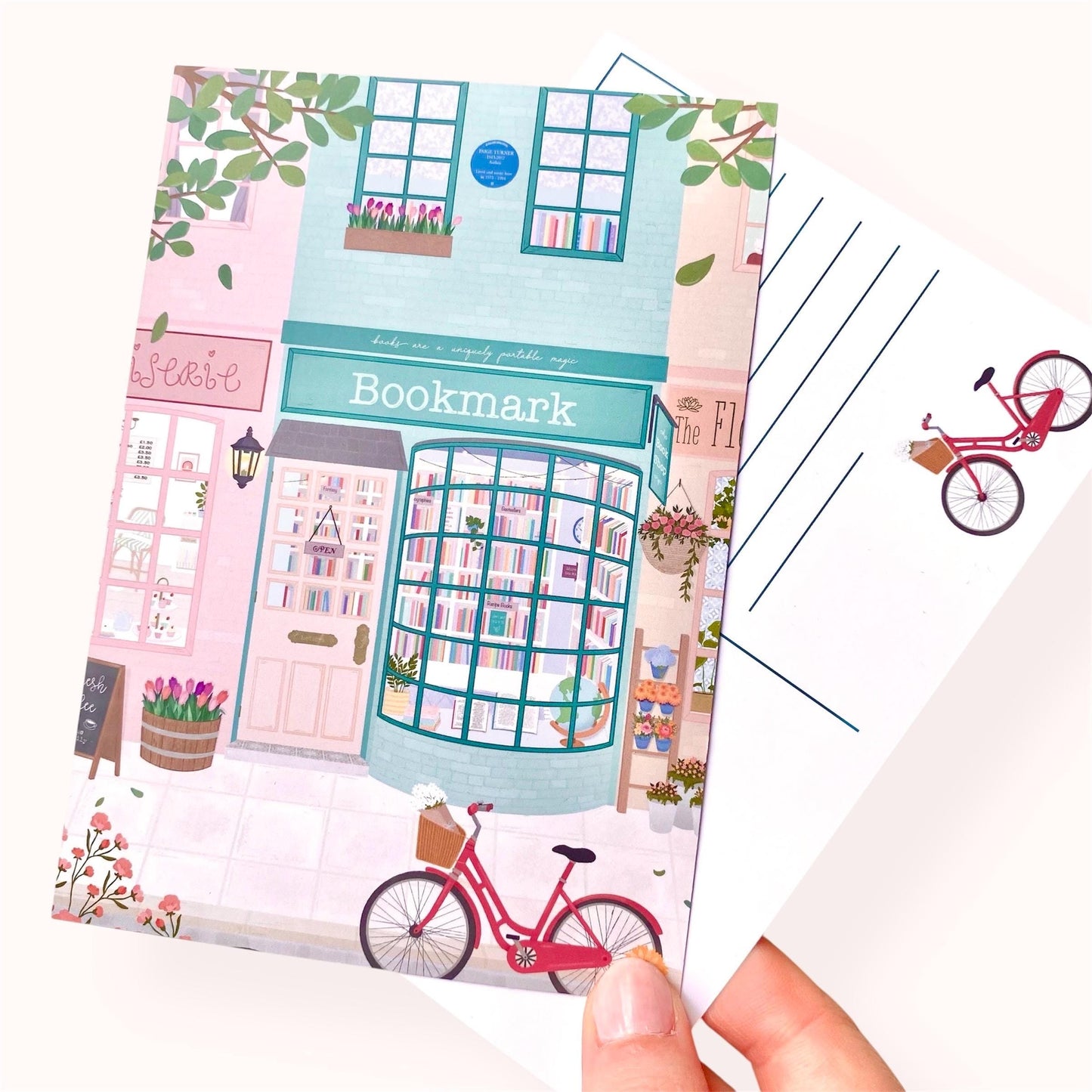 Postcard with a cute illustration of a bookshop and bicycle on a white background