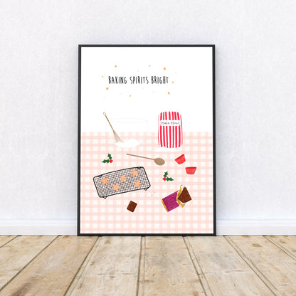 Framed artwork with pink Christmas baking-themed illustrations on a white wall.