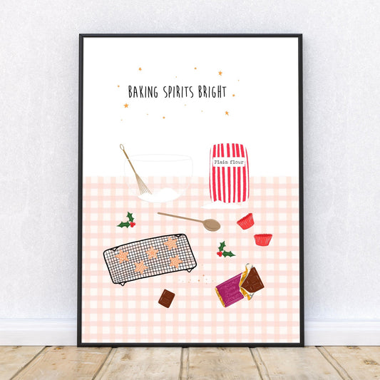 Framed artwork with pink Christmas baking-themed illustrations on a white wall.