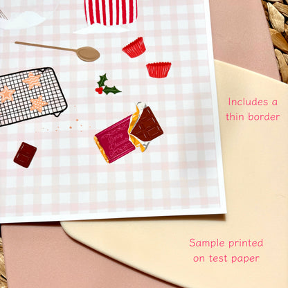 A styled flat-lay showing the corner of an art print with a pink gingham background and illustrated Christmas baking-themed elements, alongside text notes about a thin border and sample printing.