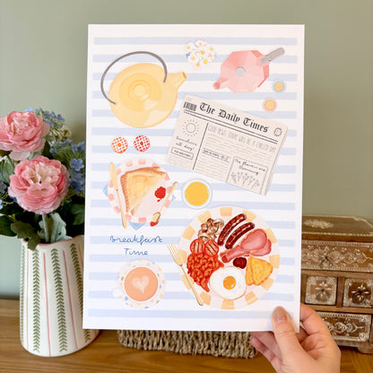 Illustrated breakfast poster held by a hand with flowers and a teapot in the background