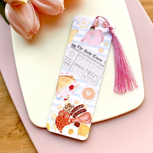 Decorative breakfast illustrated bookmark with tassel on a pink surface with tulips