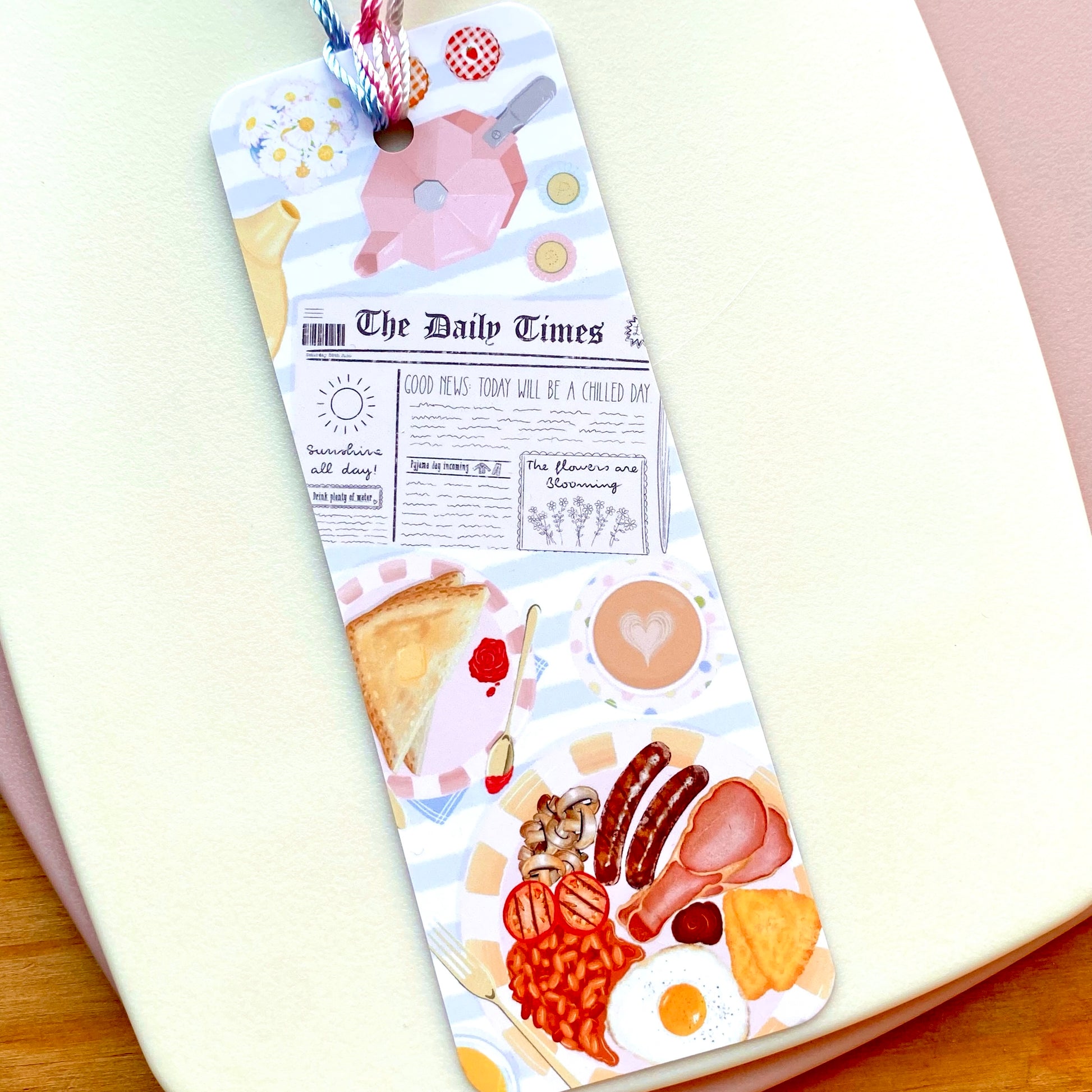 Bookmark with food illustrations on a white surface