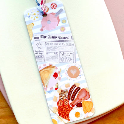 Bookmark with food illustrations on a white surface