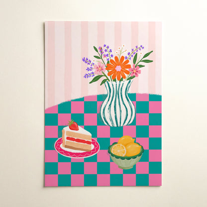 A vertical art print featuring a whimsical still life illustration of a striped vase with colourful flowers, a slice of strawberry cake on a pink plate, and a bowl of lemons, all set against a pink and teal checkered table on a pink striped background.