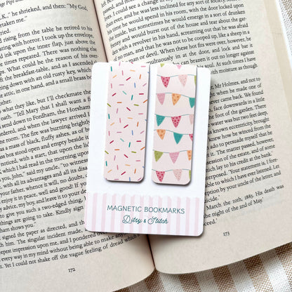 Magnetic bookmarks with colourful bunting and sprinkles designs on an open book
