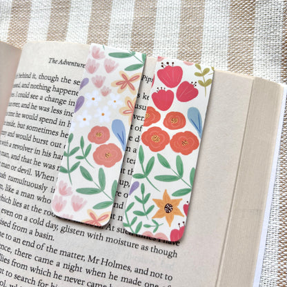 Floral bookmarks on an open book with a striped background