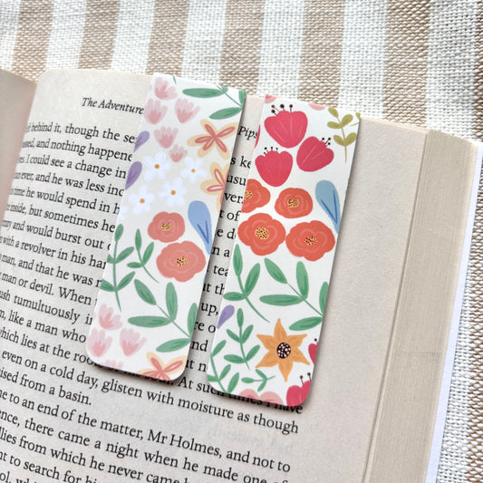 Floral bookmarks on an open book with a striped background