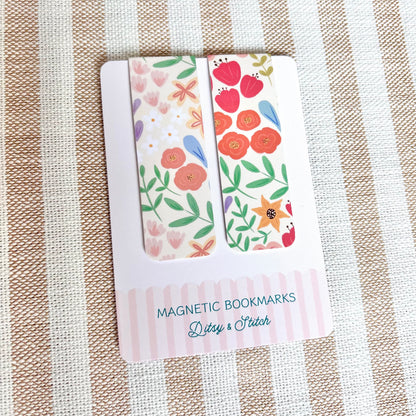 Floral magnetic bookmarks in packaging on a striped fabric background