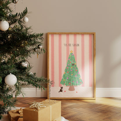 Framed Christmas-themed artwork with a tree and 'Tis the Season text next to a decorated Christmas tree.