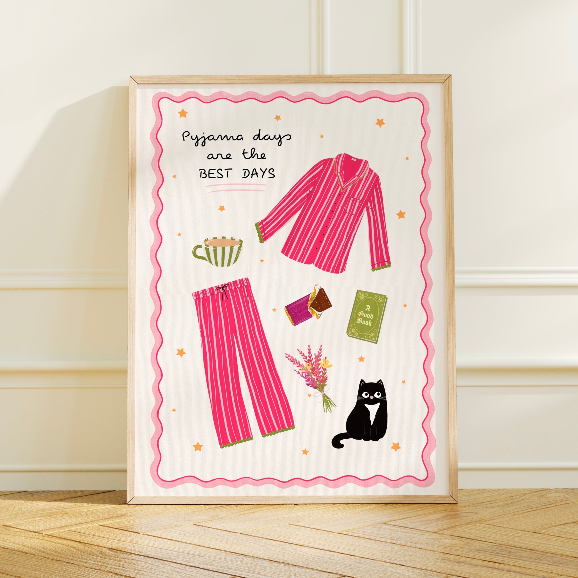 Framed artwork with pink pyjama set, tea cup, book, chocolate and cat illustration on a white background.