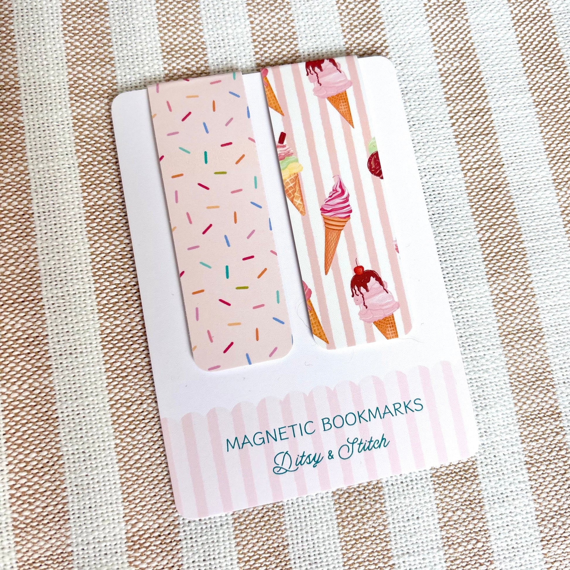 Set of magnetic bookmarks with ice cream and sprinkles designs on a striped fabric background