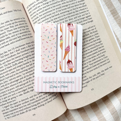 Magnetic bookmarks with ice cream and sprinkles designs on an open book with a striped fabric background