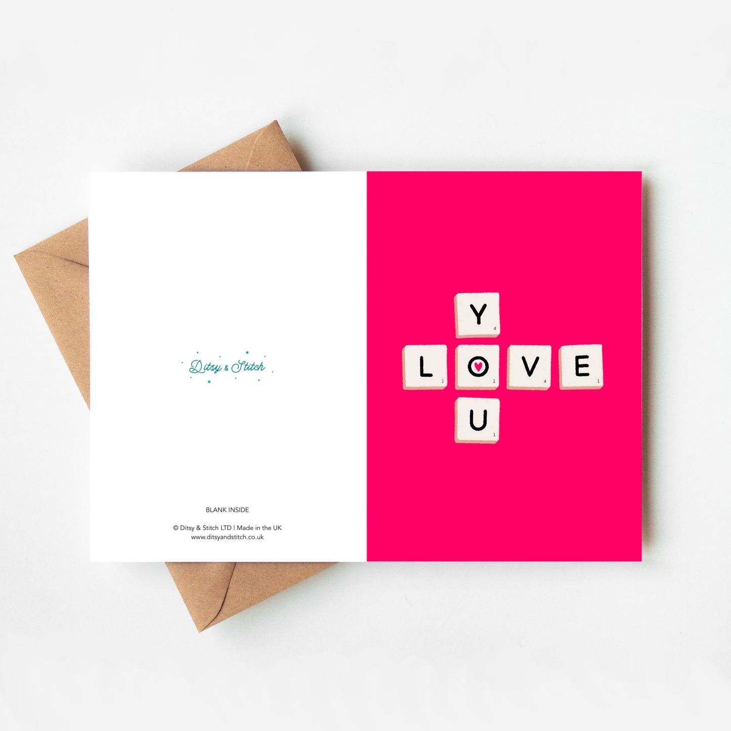 Greeting card with 'LOVE U' text on a pink background, featuring a brown envelope.