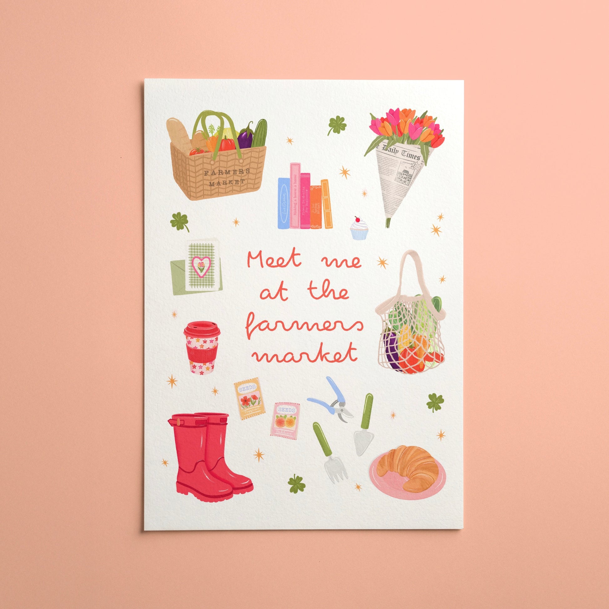 A white art print featuring a whimsical illustration of farm market items and the text 'Meet me at the farmers market' in red script, displayed against a solid peach-pink background.