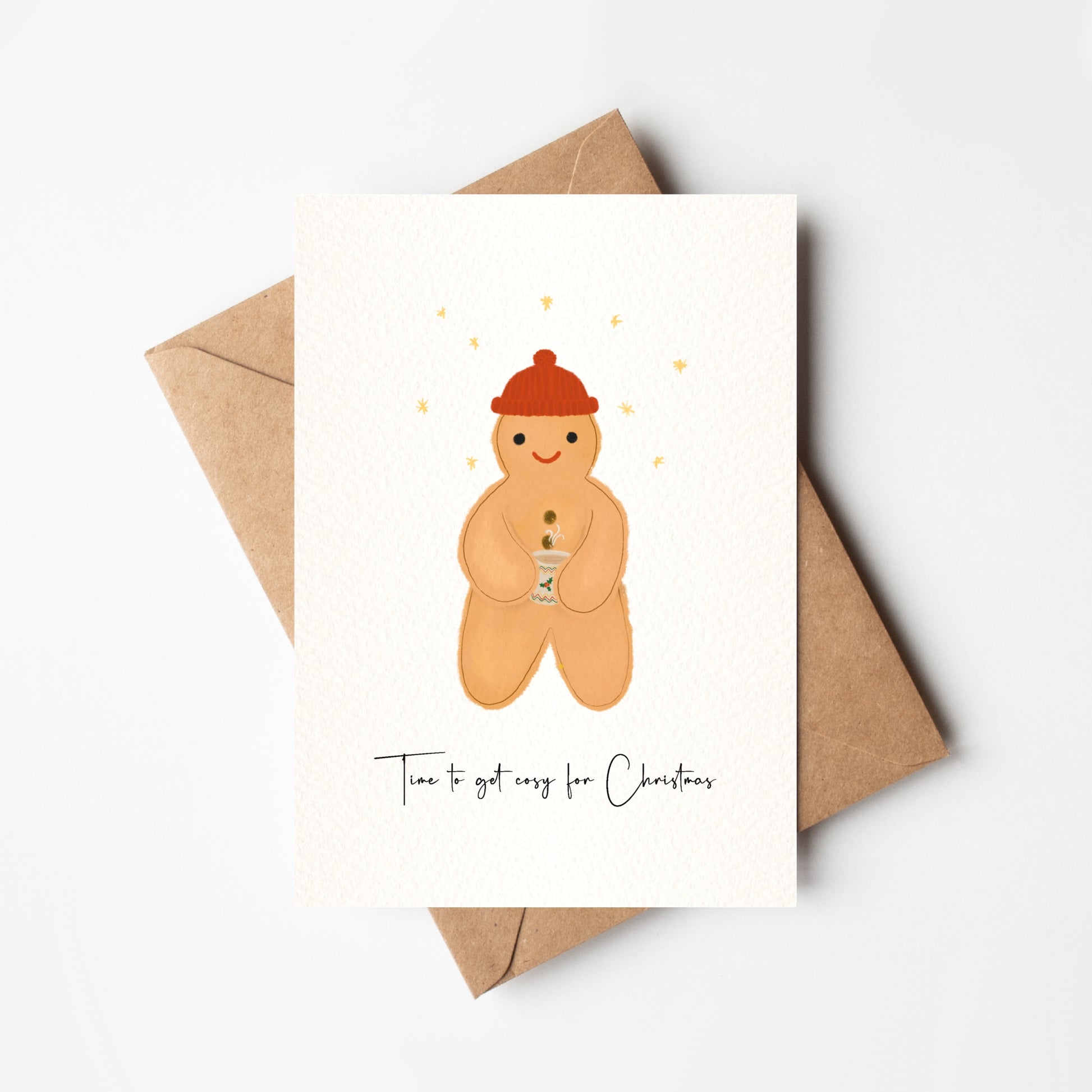 Greeting card with a gingerbread man illustration and text 'Time to get cozy for Christmas' on a white background.
