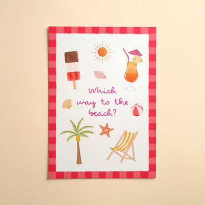 An art print with a red and pink striped border featuring summer beach-themed illustrations and the text 'Which way to the beach?' in pink script, displayed against a warm yellow background.