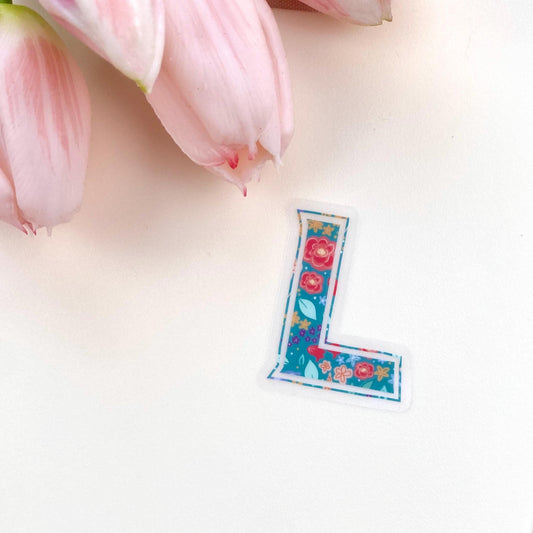Floral letter 'L' sticker on a white background with pink tulips