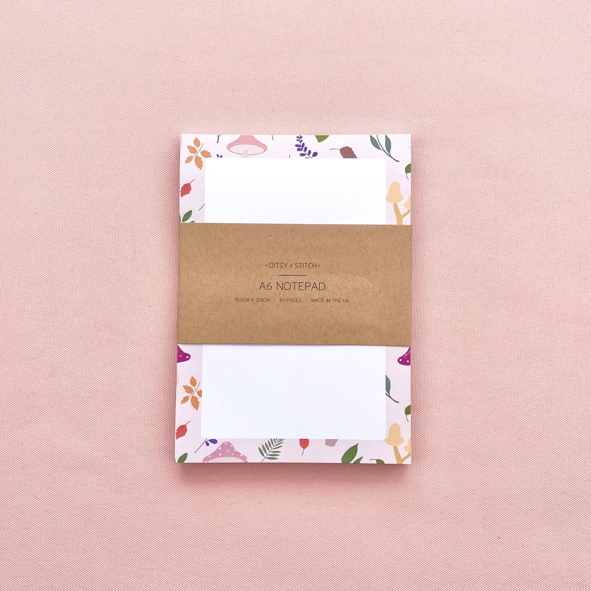 A6 notepad with leaf and mushroom pattern on a pink background