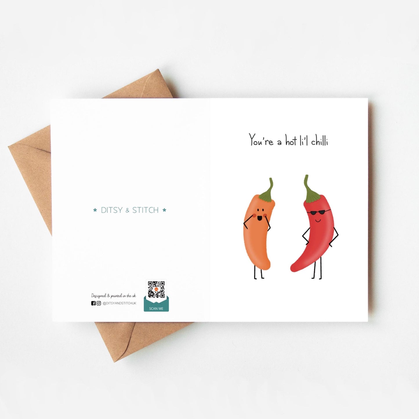 Card with cartoon red and orange  peppers and 'You're a hot li'l chilli' text and an envelope on a white background