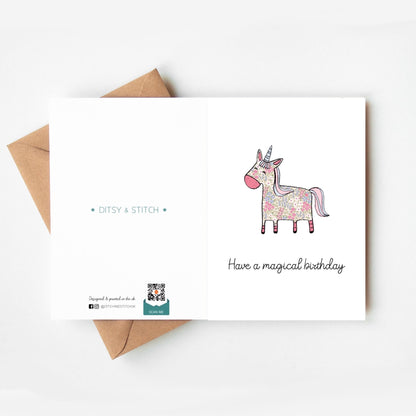 Greeting card with a unicorn illustration and 'Have a magical birthday' text, featuring Ditsy & Stitch branding on the back.