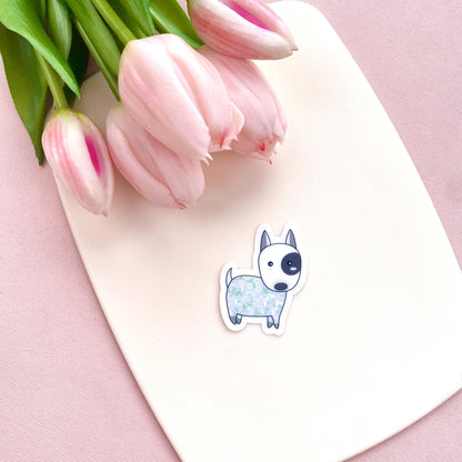 Sticker of a dog with pink tulips on a pink background