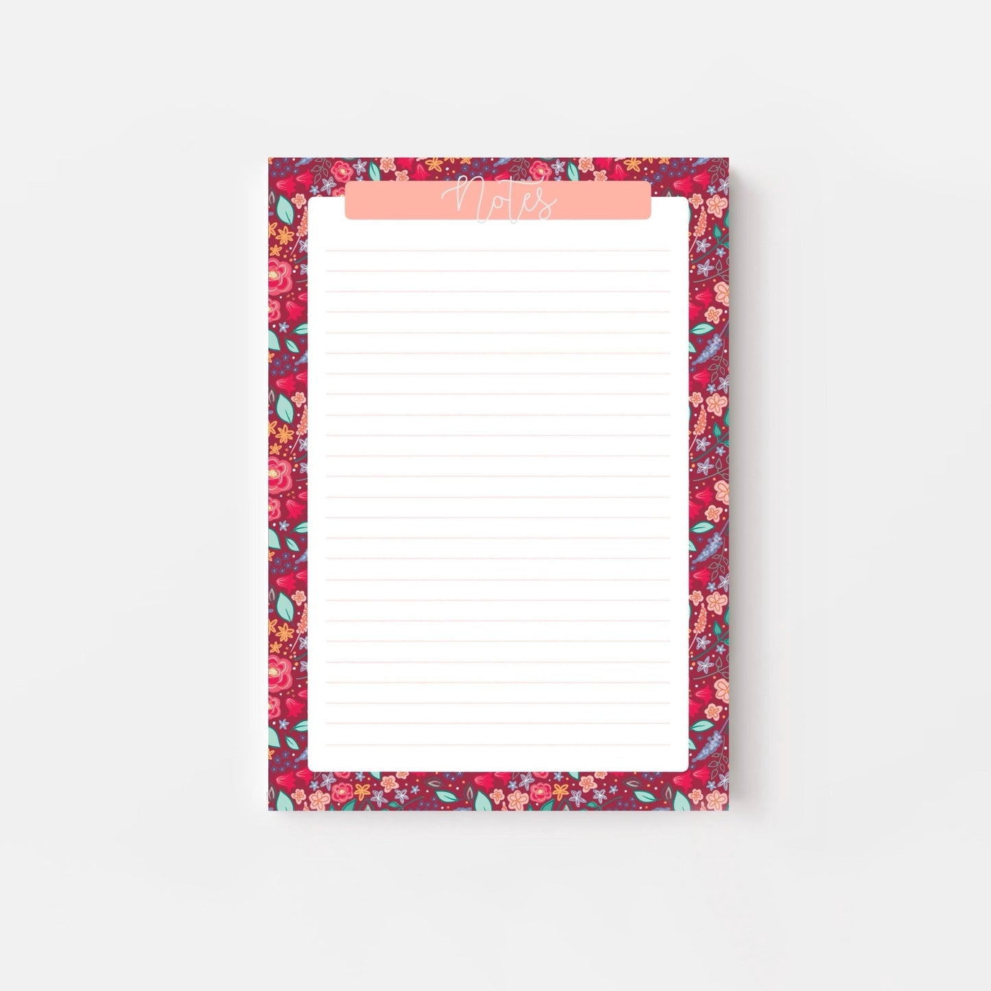 Floral patterned notepad with a pink border on a white background