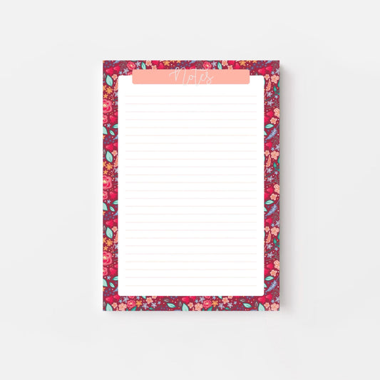 Floral patterned notepad with a pink border on a white background