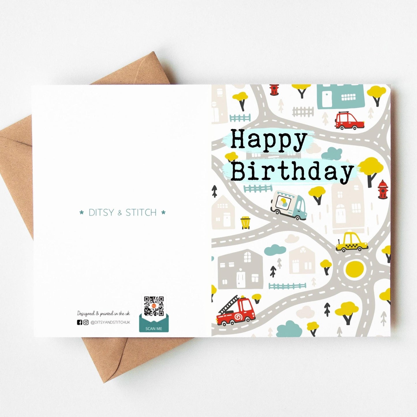 Birthday card with road map design and 'Happy Birthday' text, featuring a brown envelope.