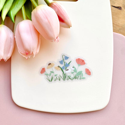 A sticker with colourful garden flowers design on a white background with pink tulips.