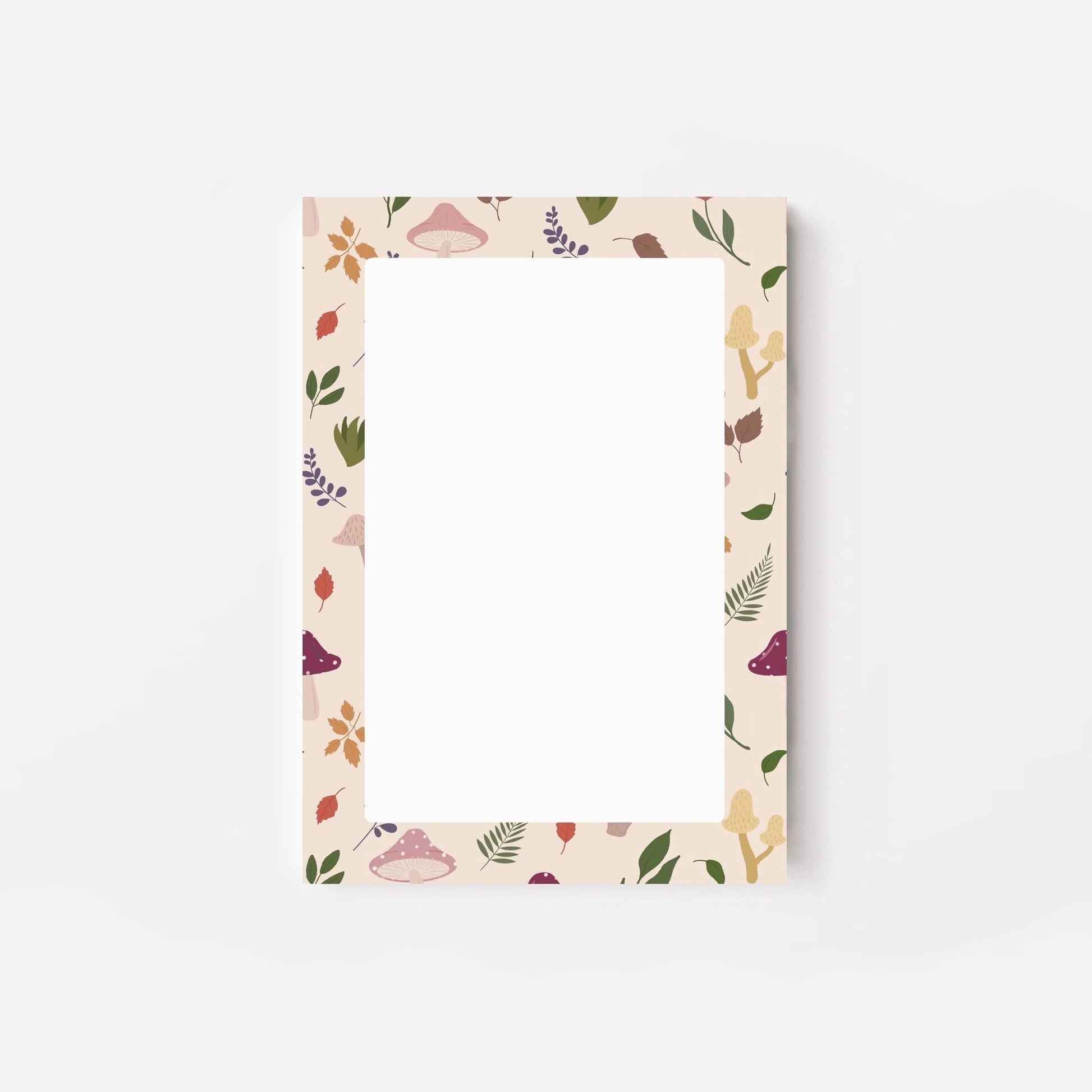 A6 notepad with leaf and mushroom pattern on a white background