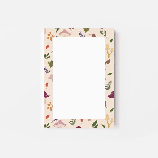 A6 notepad with leaf and mushroom pattern on a white background