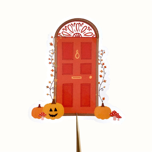 Decorative Halloween door sticker with pumpkins and a red door on a white background