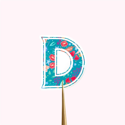 Decorative letter 'D' sticker with floral pattern on a white background