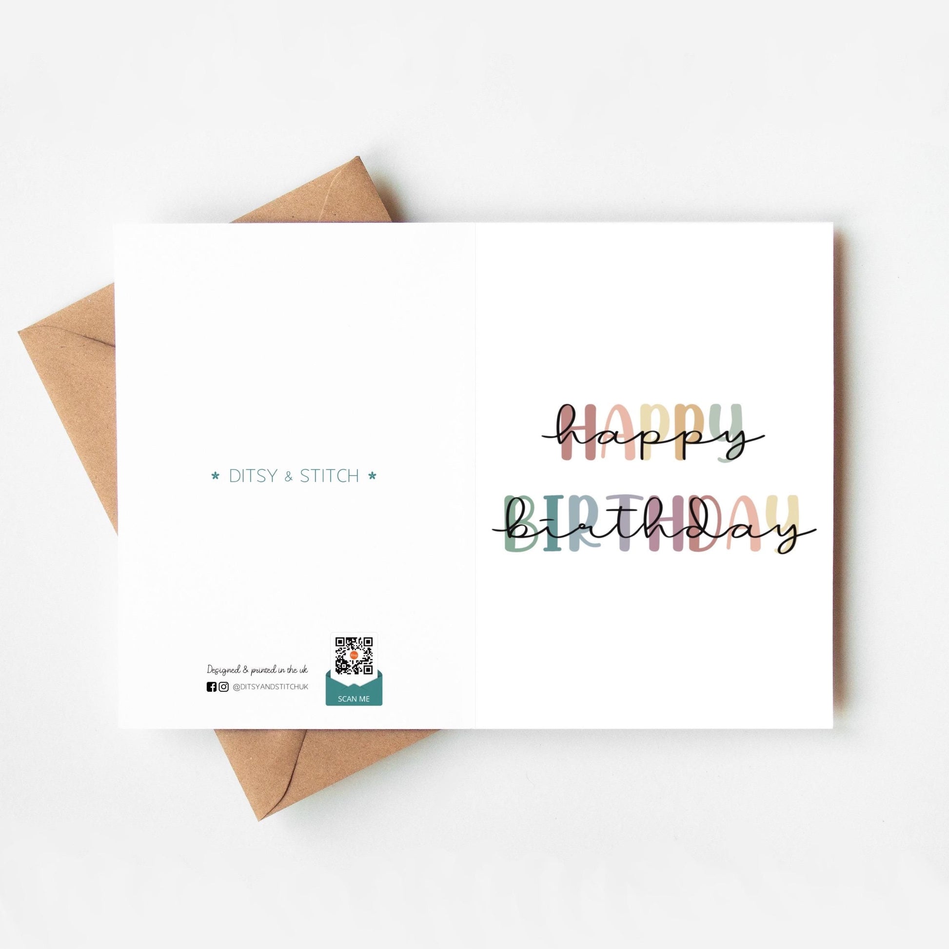Birthday card with 'Happy Birthday' text in rainbow colours and a brown envelope on a white background