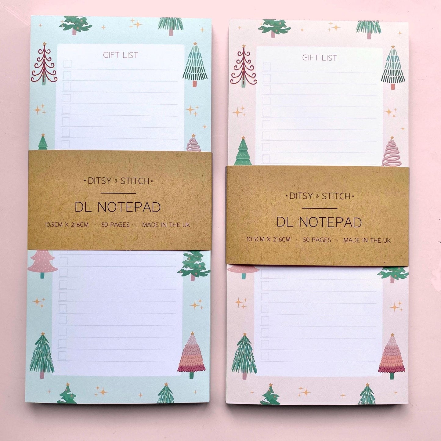 Two Slim notepads with Christmas tree design on a pink background