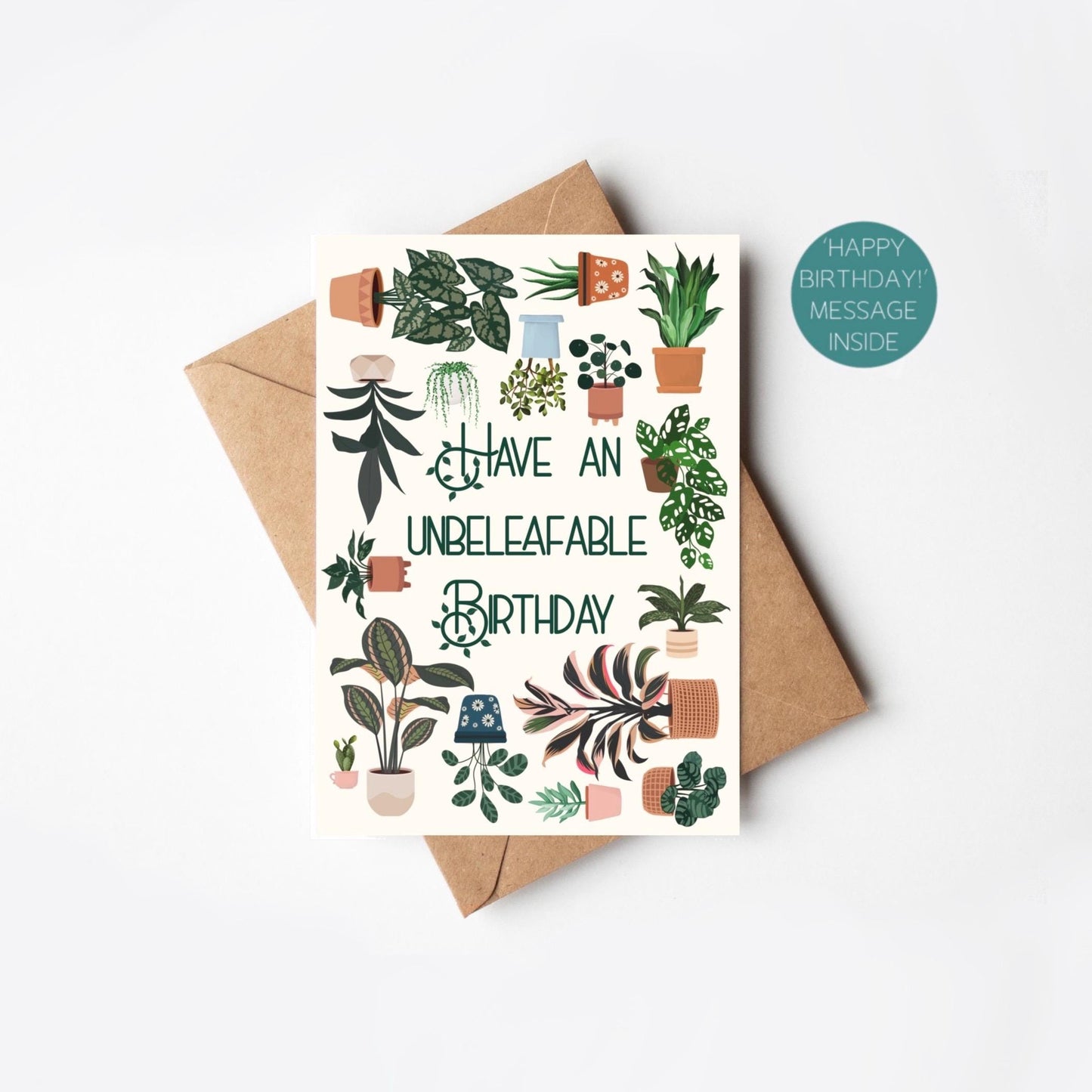 Greeting card with plant illustrations and 'Unbeleafable Birthday' text, accompanied by a brown envelope on a white background.