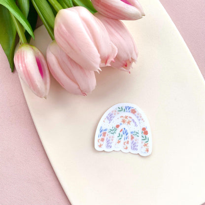 Decorative sticker with floral design on a pink surface with tulips